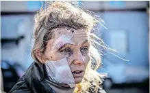  ?? ?? OLENA Kurylo, a 52-year-old teacher stands outside a hospital after the bombing of the eastern Ukraine town of Chuguiv, on February 24, 2022, during the start of the full-scale invasion of Ukraine by Russia. | AFP