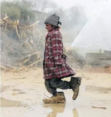  ?? AMER ALMOHIBANY / AFP / GETTY IMAGES ?? A Syrian girl is shown at a refugee camp on the outskirts of Damascus on Wednesday. An intelligen­ce report by the Canada Border Services Agency has found little evidence of security concerns regarding Syrians in Canada.