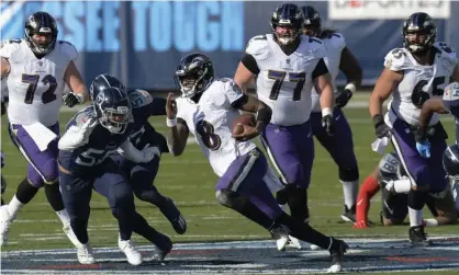  ??  ?? Lamar Jackson runs 48 yards for a touchdown against the Tennessee Titans in the first half. Photograph: Mark Zaleski/AP