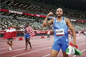  ?? CHRISTIAN PETERSEN — THE ASSOCIATED PRESS ?? Marcell Jacobs of Italy celebrates after winning the 100meters Aug. 1in Tokyo.