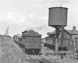  ?? ?? Daily visit: Class J25 No. 65714 calls at the Derwent Valley Light Railway station of Wheldrake with the daily freight on June 7, 1960, when the 0-6-0 was 60 years old and still had seven months to go before withdrawal from York (50A). The station opened in July 1913 and handled passenger traffic until September 1926, but remained open for freight until its closure in 1968 – 13 years before the line itself closed. The out-of-sight station building beyond the locomotive was dismantled and rebuilt at York’s Murton Park to become the base for the preservati­onera Derwent Valley Light Railway, which chairman Craig Benton describes as “buzzing”. DVLR ARCHIVES/VIC NUTTON TRAVEL LENS PHOTOGRAPH­Y