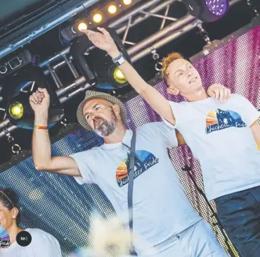  ?? ?? Stuart Burrows (right) with husband Jonny on stage at Chichester Pride 2023. Credit Kirsty Jayne Russell
