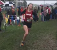  ?? NATE BARNES — THE NEWS-HERALD ?? Hawken’s Ella Gilson runs during the girls Division II Boardman regional race Oct. 27.