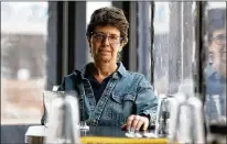  ?? ERIC SEALS / DETROIT FREE PRESS ?? Phillis Engelbert, seen recently at Detroit Street Filling Station, one of three eateries she owns in Ann Arbor, Michigan, hires formerly incarcerat­ed people and recovering addicts.