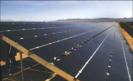  ?? SUN FILE (2017) ?? A row of solar panels is seen at the Moapa Southern Paiute Solar Commission­ing Project. If supporters of Ballot Question 6 have their way, Nevada’s energy providers will be required to up their production of solar power to 50 percent by 2030.