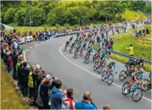  ?? THE ASSOCIATED PRESS ?? The pack rides during the second stage of the Tour de France on Sunday. The stage covered 126.5 miles from Dusseldorf, Germany, to Liege, Belgium. Marcel Kittel won in a sprint finish.