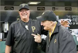  ?? Matt Freed/Post-Gazette ?? Pirates manager Clint Hurdle talks with usher Phil Coyne on Wednesday before he was honored on the field at PNC Park.