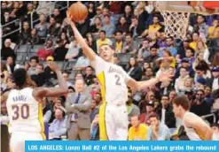  ??  ?? LOS ANGELES: Lonzo Ball #2 of the Los Angeles Lakers grabs the rebound against the Atlanta Hawks on Sunday. — AFP