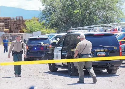  ?? .ADOLPHE PIERRE-LOUIS/JOURNAL ?? BCSO deputies investigat­e after a deputy reportedly fired shots at a suspected car thief who rammed his patrol car on July 23 in the parking lot of a flea market located on Old Coors SW.