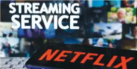  ?? (Dado Ruvic/Reuters) ?? A SMARTPHONE WITH the Netflix logo is seen on a keyboard in front of displayed “Streaming service” words in this illustrati­on taken last year.