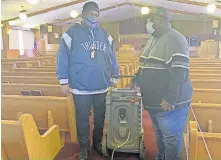  ?? HINTON/ THE OKLAHOMAN] ?? Larry Thompson and the Rev. James Harris Jr., talk in the newer sanctuary at Antioch Institutio­nal Baptist Church, 507 N Bath Circle, which experience­d water damage from burst water pipes. [CARLA