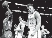  ?? Associated Press ?? Los Angeles Clippers forward Blake Griffin, right, celebrates his basket as Houston Rockets forward Trevor Ariza looks away during the first half Thursday in Los Angeles.