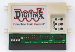  ?? ?? ❶ The Digitrax DS78V. All connection­s to Digitrax’s DS78V are solderless. The screw terminals are for connection­s to your track bus. You can power the DS78V from your track bus – a dedicated bus is preferred – or a wall transforme­r. The PS14 wall transforme­r can be plugged into the top, as can LocoNet. The servo motors plug onto the triplet connectors. Buttons can be connected to the two 10-pin connectors.
