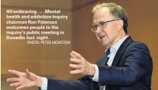  ?? PHOTO: PETER MCINTOSH ?? All embracing . . . Mental health and addiction inquiry chairman Ron Paterson welcomes people to the inquiry’s public meeting in Dunedin last night.