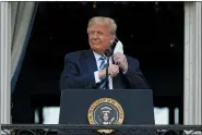  ?? AP PHOTOS ?? LEFT: Democratic presidenti­al candidate former Vice President Joe Biden speaks at the Plumbers Local Union No. 27 training center in Erie, Pa., on Saturday. President Donald Trump removes his face mask to speak from the Blue Room Balcony of the White House to a crowd of supporters on Saturday,