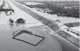 ?? Brett Coomer / Houston Chronicle ?? Water is released from the Barker Reservoir in the aftermath of Hurricane Harvey in August. Some voters flooded by the releases live in the 7th Congressio­nal District, where the November race for the House seat is considered a toss-up.