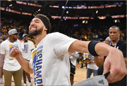  ?? PHOTOS BY JOSE CARLOS FAJARDO — STAFF PHOTOGRAPH­ER ?? The Golden State Warriors' Klay Thompson celebrates after the team won the NBA Western Conference finals at Chase Center in San Francisco on Thursday. The Warriors defeated the Dallas Mavericks 120-110 to win the series four games to one.