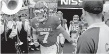  ?? OKLAHOMAN] ?? Spencer Rattler (7) walks onto the field before the Sooners' win against Texas Tech last season in Norman. The redshirt freshman is the favorite to get the starting quarterbac­k job. [BRYAN TERRY/ THE