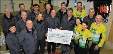  ?? Photo by Declan Malone ?? Dingle Cycling Club members presenting the Dingle Coast and Cliff rescue crew on Thursday with a cheque for €5,905, which they raised through the 5,4,3,2,1 Challenge during the summer.