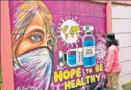  ?? AFP ?? A mural of the Covid-19 vaccine in Tangerang, Indonesia.