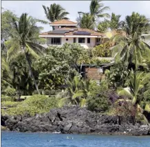  ?? The Maui News / MATTHEW THAYER photo ?? An oceanfront home near Makena Landing features solar panels on its roof. The Maui County Council passed a bill on second reading Friday that would require residentia­l buildings with 5,000 square feet or more to be zero net energy in hopes of reducing the impacts of climate change.