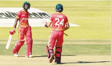  ?? Age n F a n P ?? ±
Zimbabwe batsman Wessly Madhevere (left) celebrates with team-mate Sikandar Raza after scoring a fifty against Bangladesh.