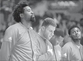  ?? Robert Gauthier Los Angeles Times ?? DeANDRE JORDAN, left, stands for the national anthem last season. The Clippers center said he was moved by talks with service members at Pearl Harbor.