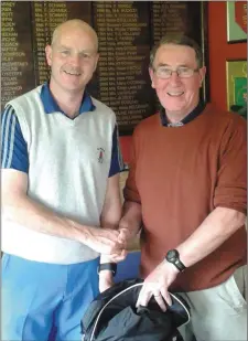  ??  ?? Newmarket Golf Society president Jim Cronin presenting his prize to winner Donal O’Sullivan.