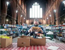  ?? GETTY ?? ‘Desperate need’: Sir Keir Starmer visits a food bank before vote last night