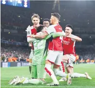  ?? ?? HEBAT: Raya, Martin Odegaard, Bukayo Saka, Ben White dan Declan Rice meraikan gol dari sepakan penalti pada perlawanan Liga Juara-Juara di antara Arsenal dan Porto di Stadium Arsenal di London, kelmarin.