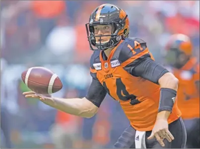  ?? The Canadian Press ?? B.C. Lions quarterbac­k Travis Lulay tosses the ball to teammate Emmanuel Arceneaux during first-half CFL action against the Edmonton Eskimos in Vancouver last Thursday. Today, the Lions (3-4) visit the Toronto Argonauts (2-5) in a 1 p.m. PT kickoff.