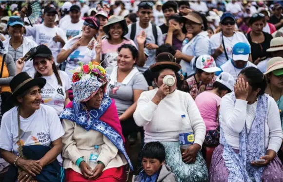  ?? RODRIGO ABD/THE ASSOCIATED PRESS ?? An overflowin­g crowd awaits the arrival of Pope Francis in Puerto Maldonado, Peru, on Friday. He called the Amazon the “heart of the church” and urged a defence of its life, land and cultures.