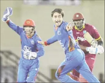  ??  ?? Champion leg-spinner Rashid Khan.