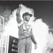  ?? Jared C. Tilton / Getty Images ?? Kyle Larson celebrates after winning the NASCAR Cup Series race at Bristol Motor Speedway.