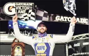  ?? Jared C. Tilton / Getty Images ?? Chase Elliott celebrates in Victory Lane after winning the NASCAR Cup Series Xfinity 500 at Martinsvil­le Speedway on Sunday in Martinsvil­le, Va.