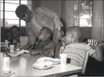  ?? U-T FILE PHOTO ?? In 1969, the Black Panthers fed tens of thousands of San Diego children. Here they serve breakfast at Christ the King church.