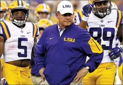  ?? AP/ JONATHAN BACHMAN ?? LSU Coach Les Miles said his team still has a lot to play for despite losing their fi rst game of the season to Alabama 30- 16 last Saturday. The Tigers were ranked No. 2 in the initial College Football Playoff poll last week but are expected to fall...