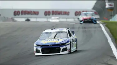  ?? JOHN MUNSON — THE ASSOCIATED PRESS ?? Chase Elliott (9) heads into turn one during a practice run for the NASCAR Cup Series auto race at Watkins Glen Internatio­nal, Saturday in Watkins Glen, New York.