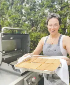  ?? ZOE FORD ?? Top Chef Canada contestant Jo Notkin shows off a little of what you can accomplish with an outdoor cooking setup.
