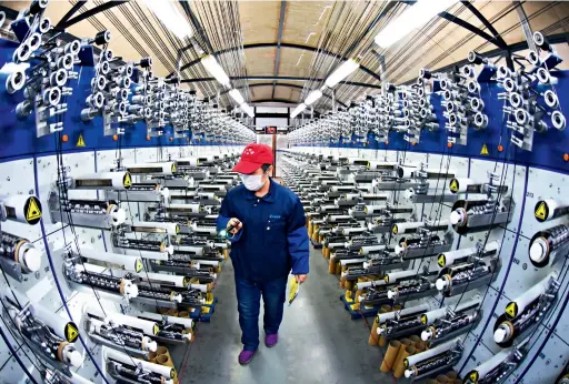  ??  ?? March 2019: The carbon fiber production line of a factory in the Economic and Technologi­cal Developmen­t Zone of Lianyungan­g, Jiangsu Province.