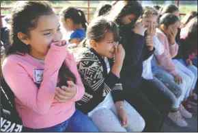  ?? NEWS SENTINEL PHOTOGRAPH­S BY BEA AHBECK ?? Beckham Elementary fourth-graders Mykaela Reyes Bravo and Michelle Sandoval, both 9, hold their noses Tuesday as they pass by turkey manure during a tour of Steamboat Acres in Courtland, part of the Field Trips on the Farm program.