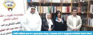  ?? —KUNA ?? CAIRO: Officials pose for a group photo during a ceremony held to inaugurate Al-Babtain Central Library for Arabic Poetry’s corner in Kuwait Cultural Office in Cairo, Egypt.