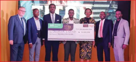  ??  ?? L-R: Chris Parkes, Mide Akinlaja, Tonye Cole, Joshua Idiong, Lilian Olubi, Kyari Bukar and Chief Marketing Officer, Heritage Bank Plc., Fela Ibidapo presenting a cheque of N10milion to Season Seven Winner Idiong at the grand finale last year