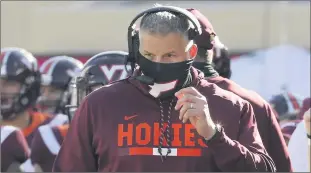  ?? MATT GENTRY/AP ?? Pitt players, shown above taking the field before a game against NC State will wear masks on the field Saturday like Virginia Tech coach Justin Fuente, above.