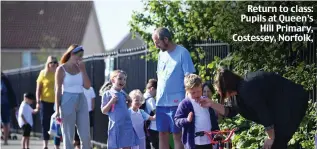  ??  ?? Return to class: Pupils at Queen’s Hill Primary, Costessey, Norfolk,