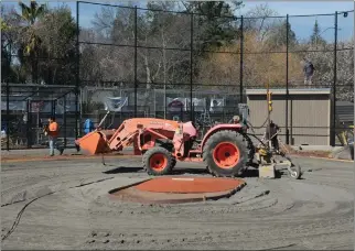  ?? ALAN DEP — MARIN INDEPENDEN­T JOURNAL ?? A crew works to renovate the ballfield this month at Bacich Elementary School in Kentfield.