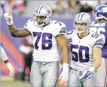  ?? SETH WENIG /
ASSOCIATED
PRESS ?? Dallas defensive end Greg Hardy (left) and linebacker Sean Lee (50) celebrate after Hardy sacked New York quarterbac­k Eli Manning Sunday. Hardy later lambasted the Cowboys special teams after giving up the winning TD.