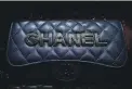  ?? GETTY IMAGES ?? A counterfei­t Chanel luxury bag for sale in Hong Kong. There is a thriving online trade in fake branded goods.