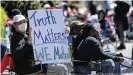  ??  ?? Protesters gather in downtown Elizabeth City where Andrew Brown's family addressed reporters