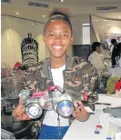  ?? Mark Allix ?? Young engineer: Kamogelo Sihlangu, a Grade 10 pupil from Ivory Park Secondary School in Midrand, shows off her programmab­le electric vehicle in Houghton on Friday. /